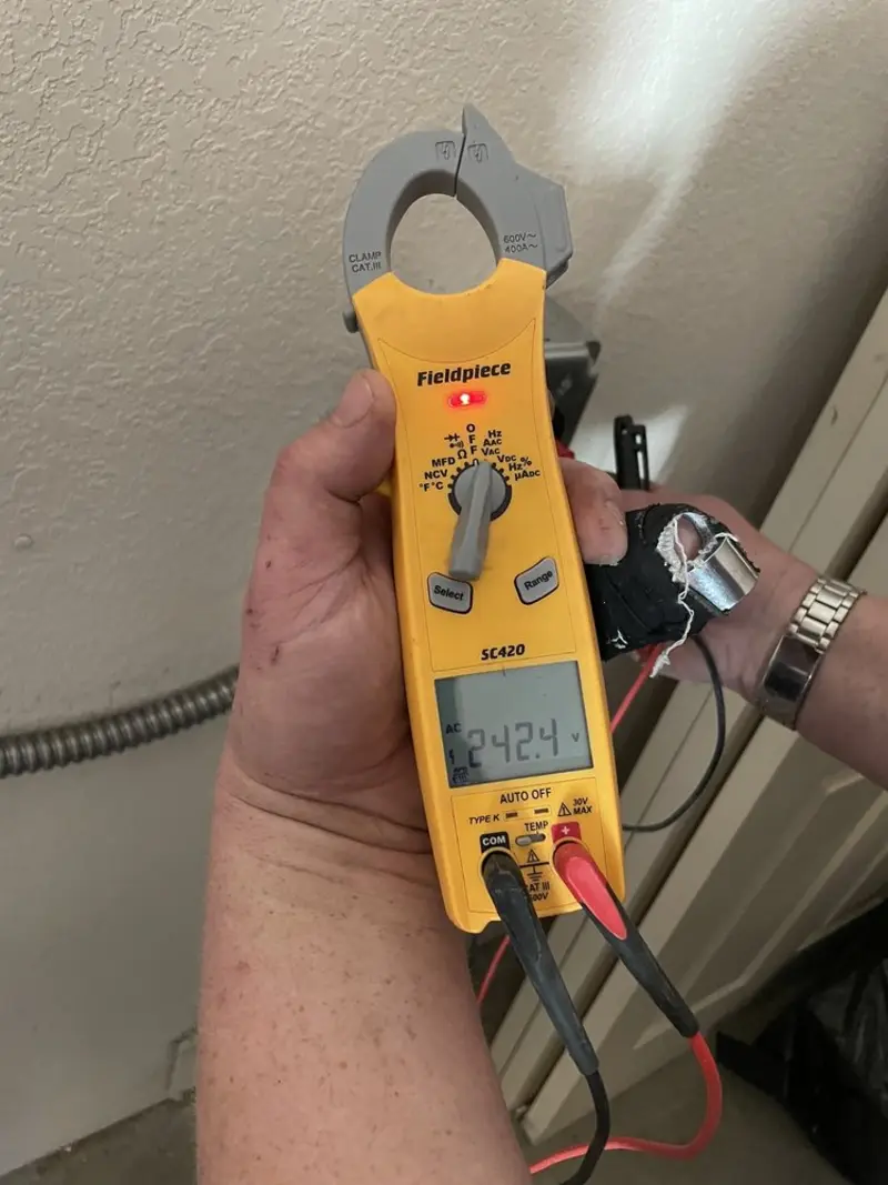 Voltage testing with clamp meter during Whole House Surge Protector in Little Elm